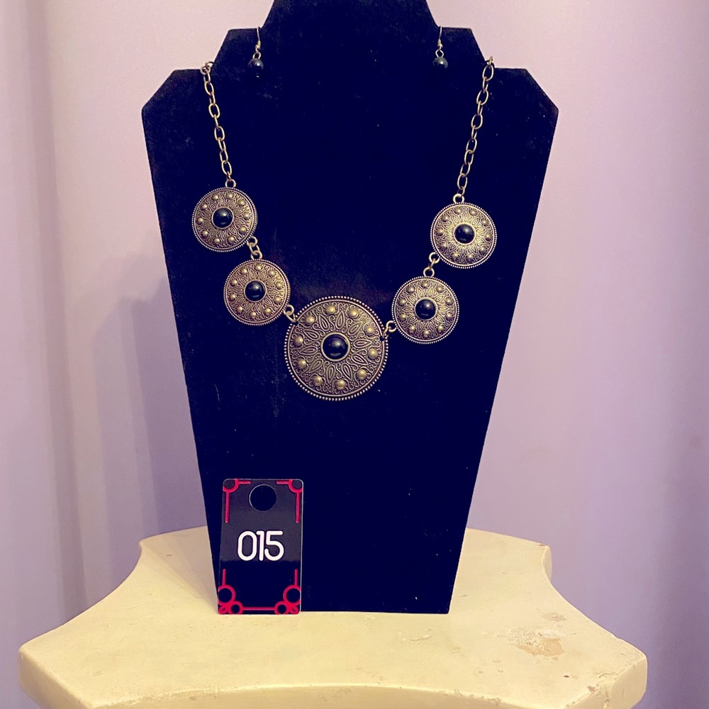 This is a very unique black and bronze color necklace with matching earrings